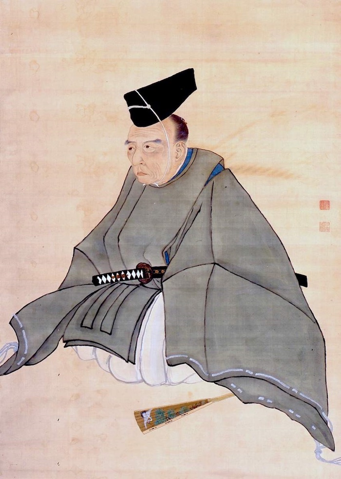 Portrait eines japanischen Adligen in formalem Kimono, sitzend.